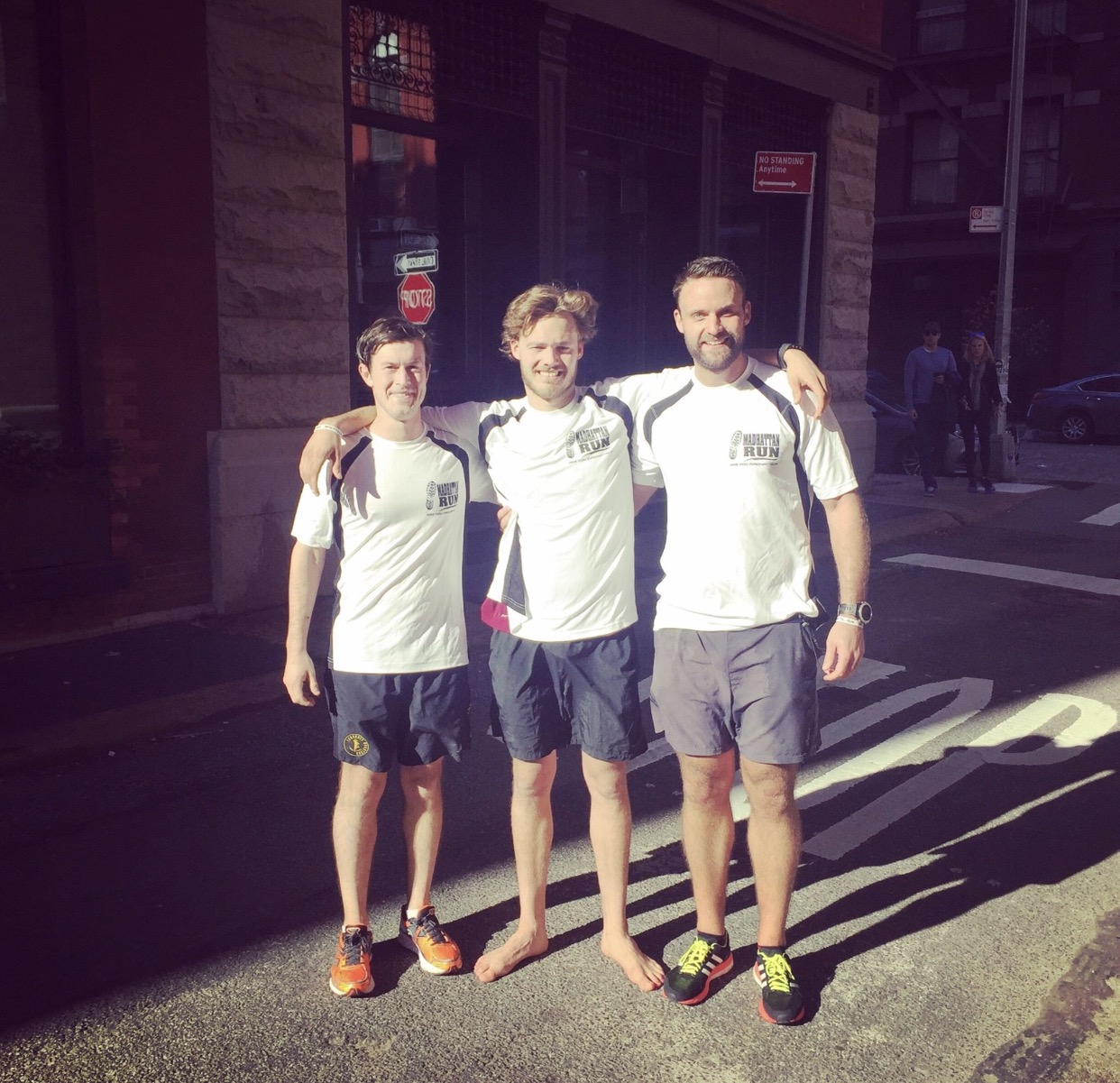 Matthew, center, giving his feat a rest after his run around Manhattan