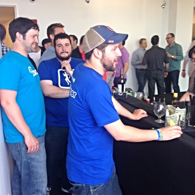 The RunKeeper team ordering up drinks at the bar. 