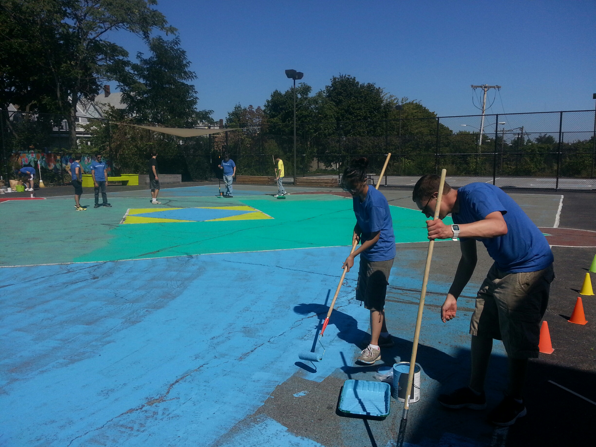 Teams from Constant Contact and Ernst & Young work on outdoor play areas at the Arthur Healy School in Somerville