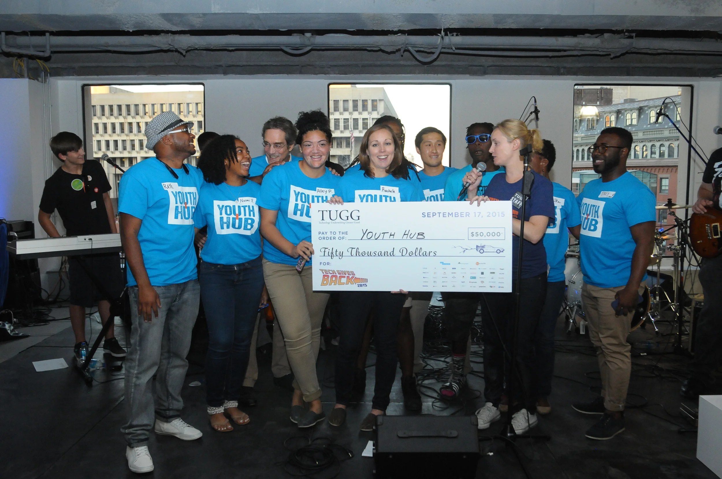 Team Youth Hub accepts their $50k grant win in the New Organization category