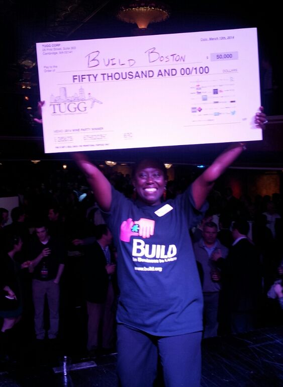 BUILD Executive Director Ayele Shakur celebrates a Wine Party win!