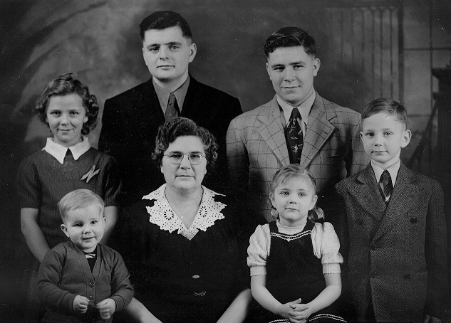 Uncle Ammon &amp; Uncle John&nbsp;in back row. My beautiful mom is far left in the back.&nbsp;