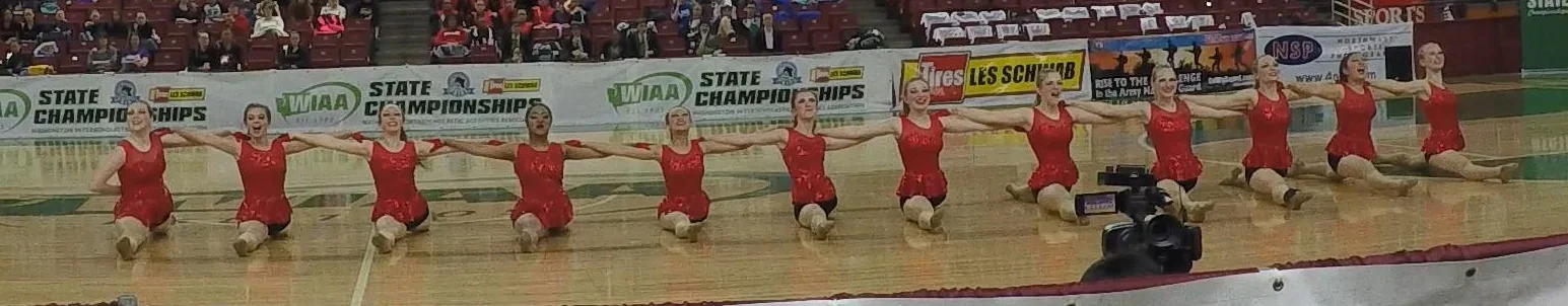 Jessie is the fifth from the right (her toes are barely hidden by the view finder). 