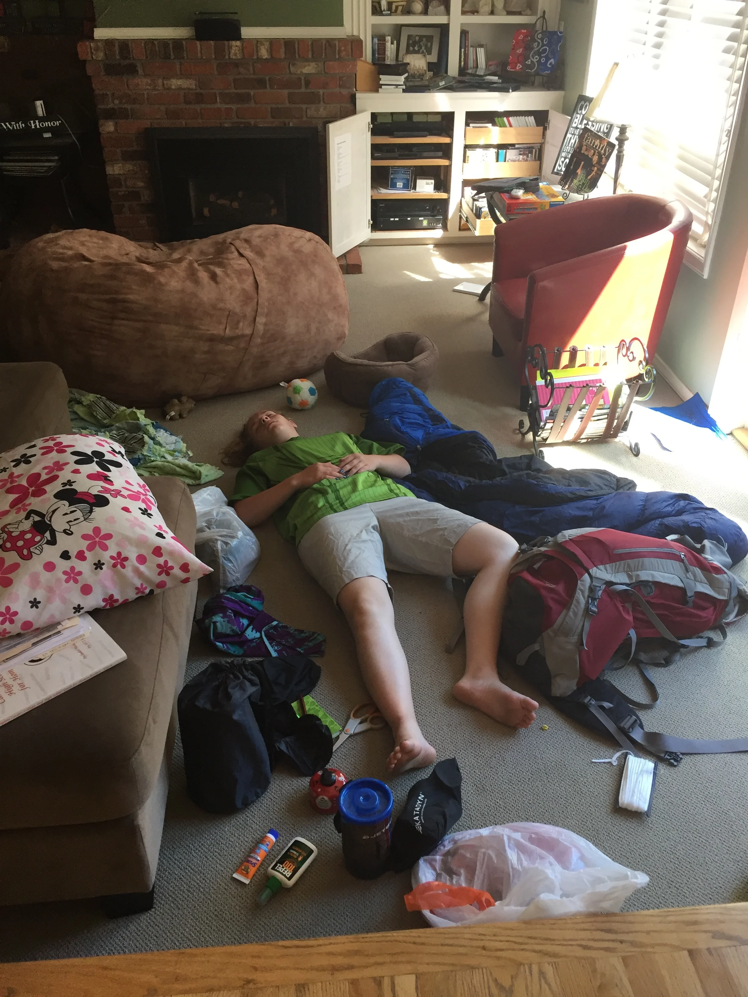 Jessie upon arrival home from girls camp. She didn't even get her bags unpacked before she was out!