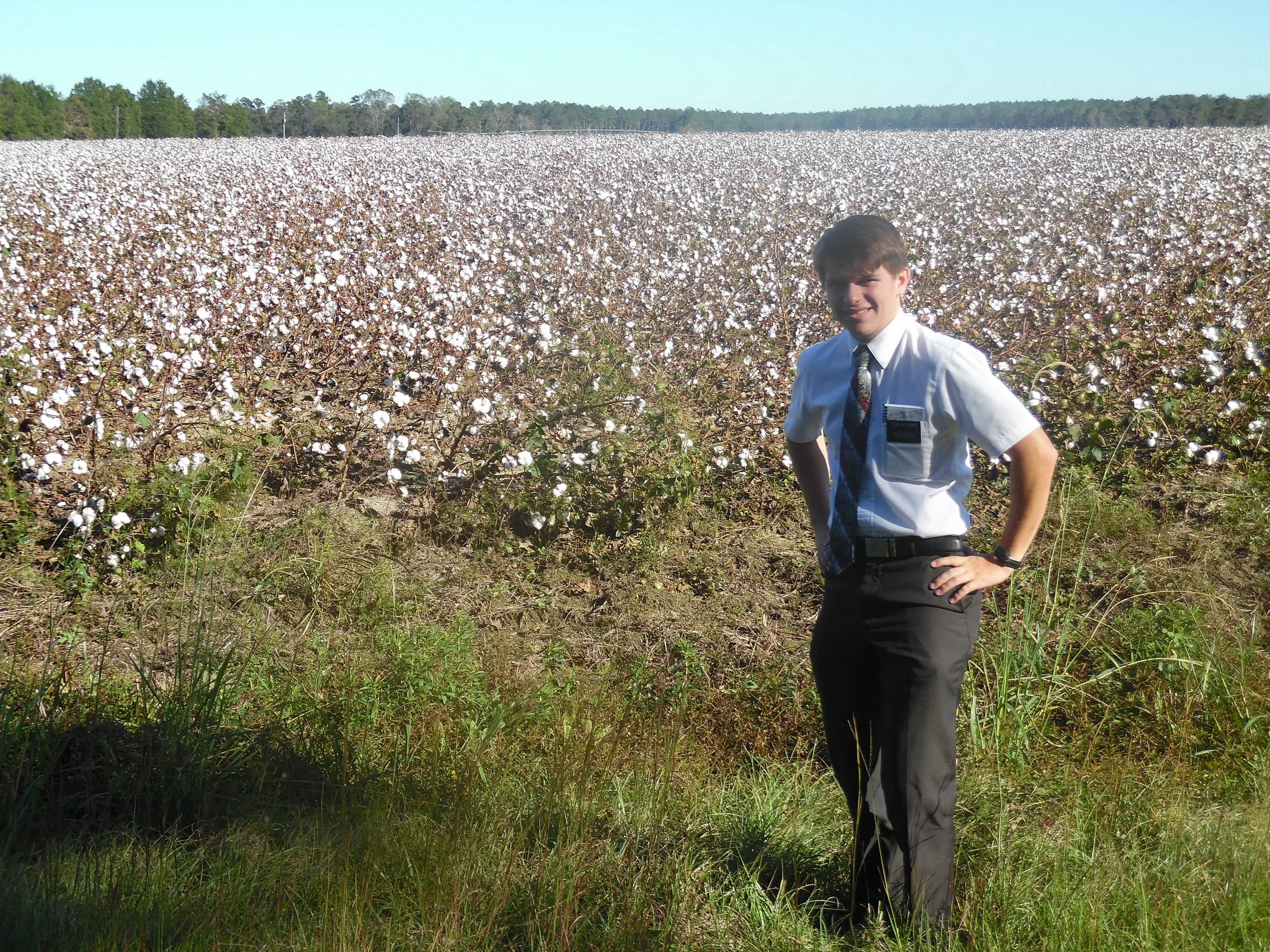 Elder Blanding in a cotton field. He said he was getting bit by bugs in this photo. "The field is white..."