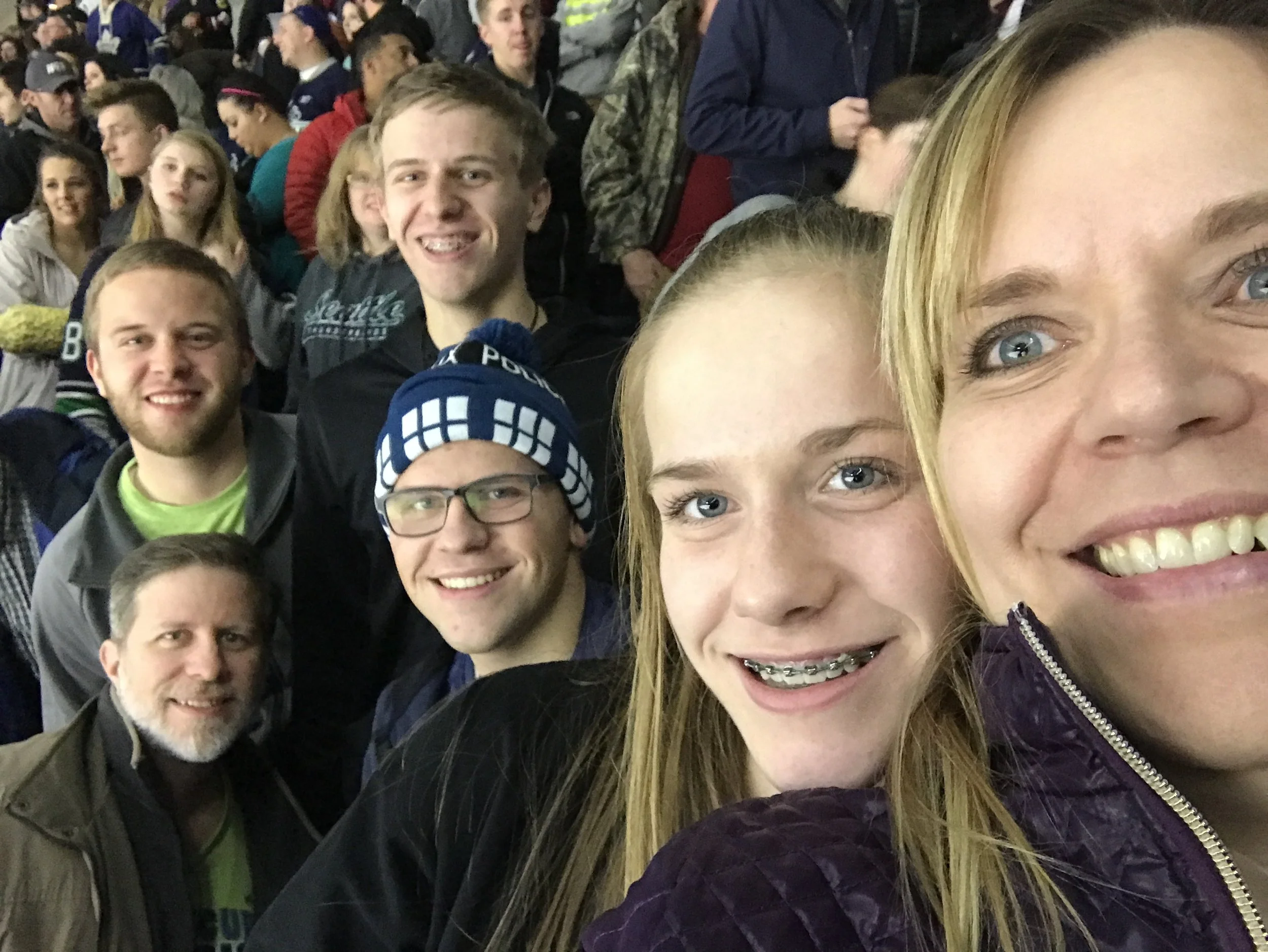 Jason, Chris, Steve, Mike, Jessie and Doreen at a hockey game.