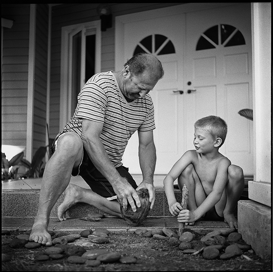 After 30 minutes, I threw in the towel on trying to split open the coconut Jasper found, so he employed Grandpa's help.