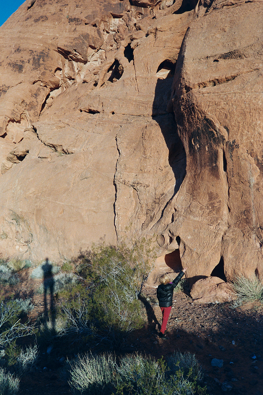 Somewhere in the Lake Mead recreation area, trying to throw rocks into the roles in the rock formations...hours of free entertainment :)