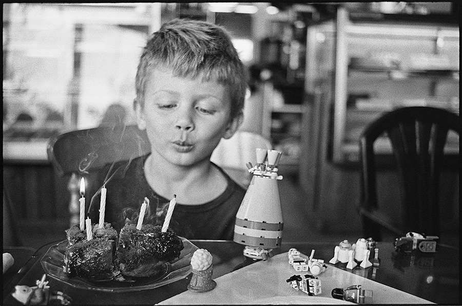 A birthday cinnamon roll all to himself at Oma's Bakery.