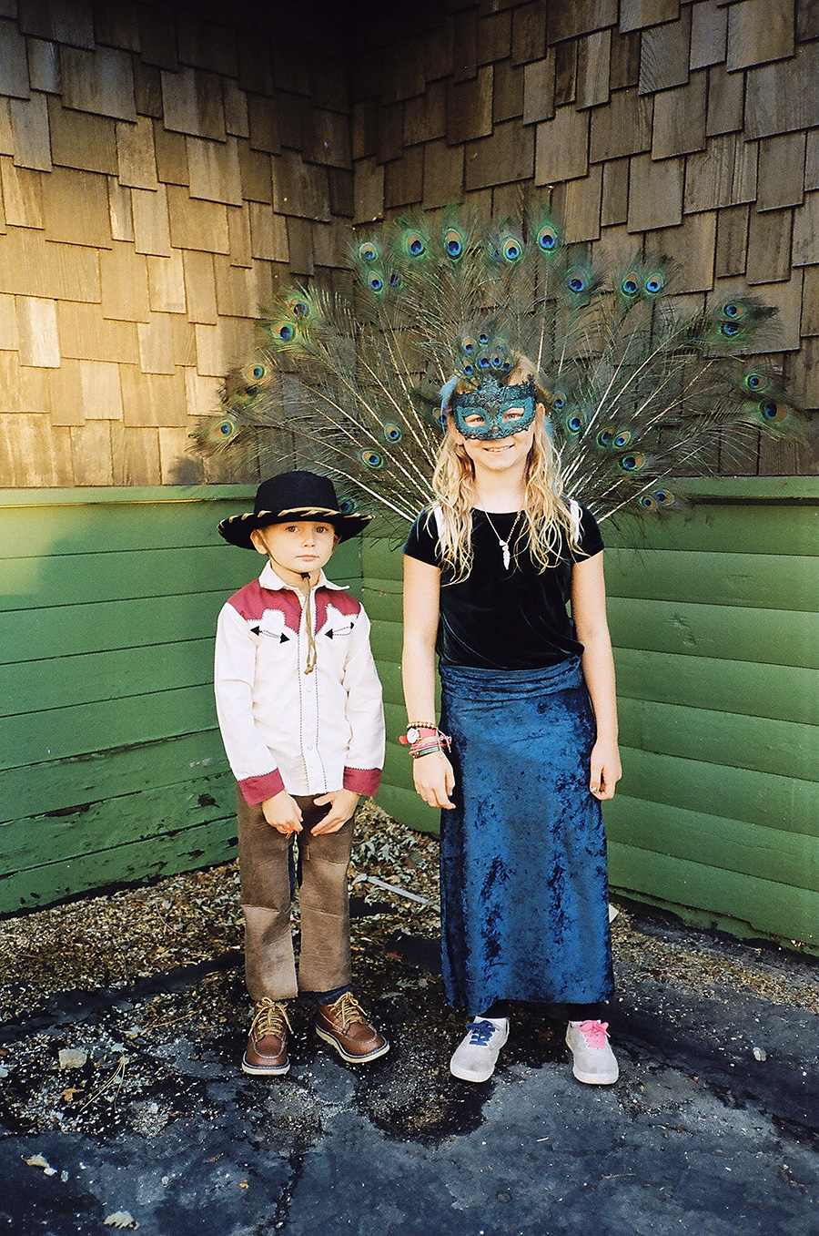 Halloween 2013. Jasper the cowboy, wearing leather chaps Grace made for him. Grace the peacock, a costume she designed and made all by herself.