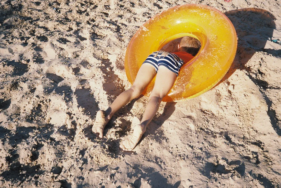 ^ That time Jasper ran down the hill, completely biffed it, and was stuck in his inner tube face down in the sand.