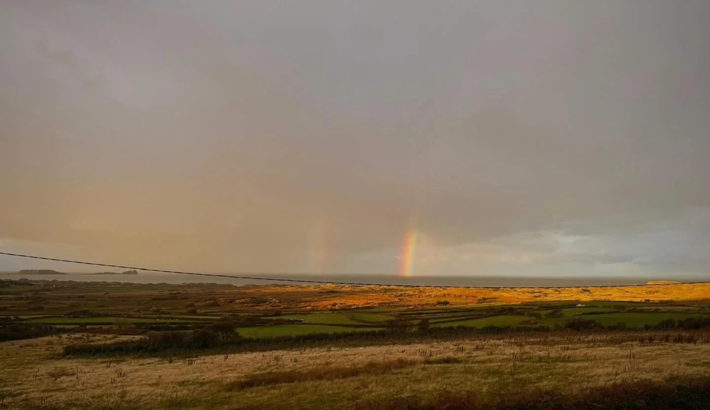 Not one, but two rainbows, just now. Had to post! Image taken from the house out over #RhossiliBay with #WormsHead in distance. #Gower #Cymru #Wales