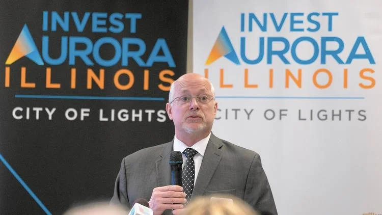 David A. Hulseberg from Invest Aurora speaks during a press conference at the old Aurora Public Library building in downtown Aurora Monday. A high tech company will move into the building. (Sean King / The Beacon-News)