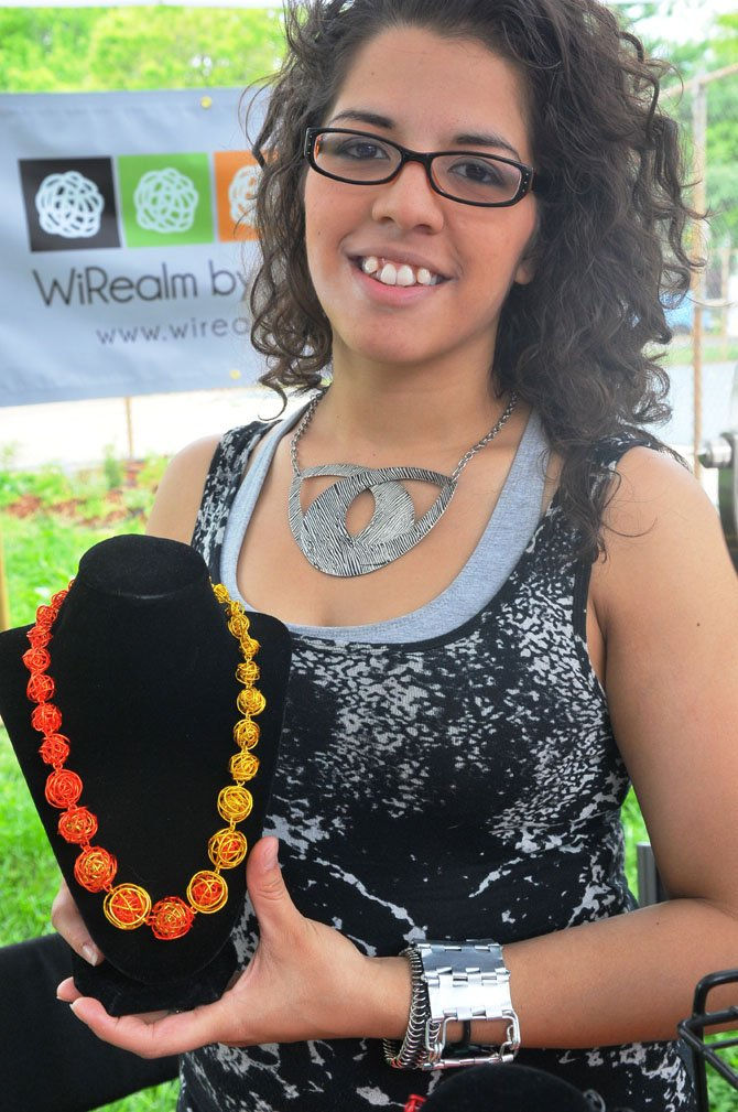 Connection Newspapers : Del Ray Art Market Opens for Season - Tamara Wilkerson shows one of her WiRealm creations. Photo by Louise Krafft
