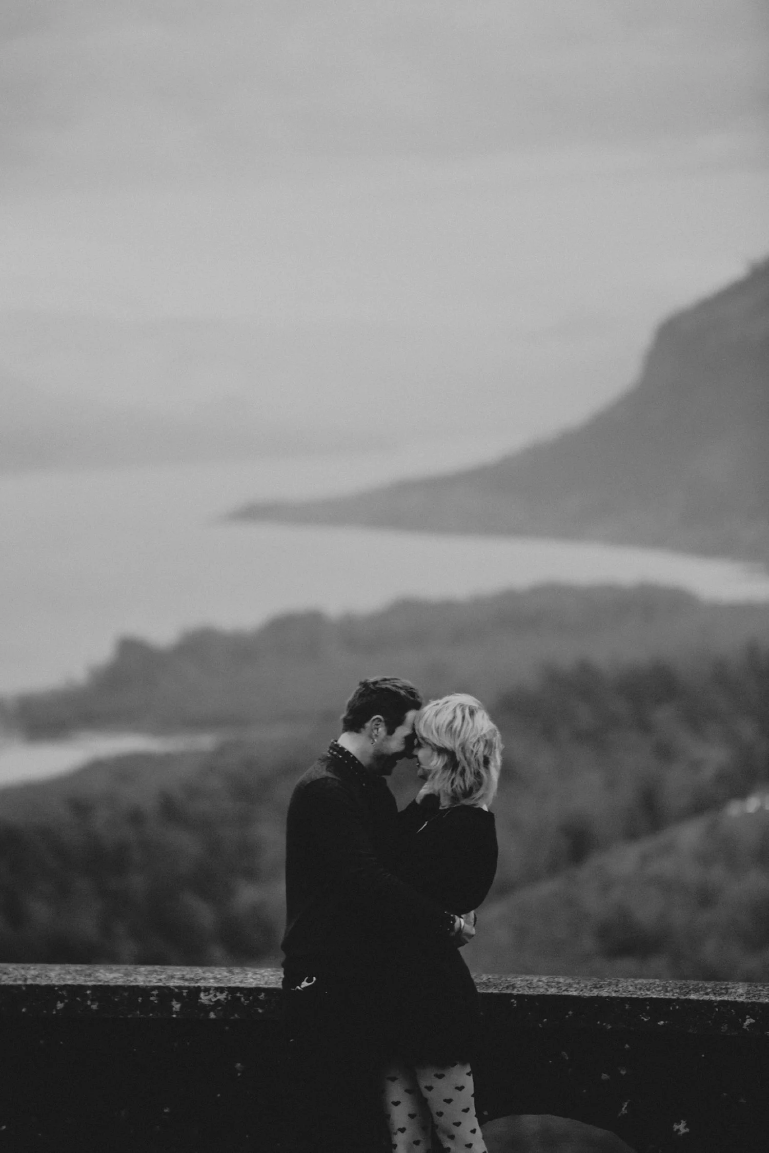 An engagement photo with the Columbia Gorge in the background