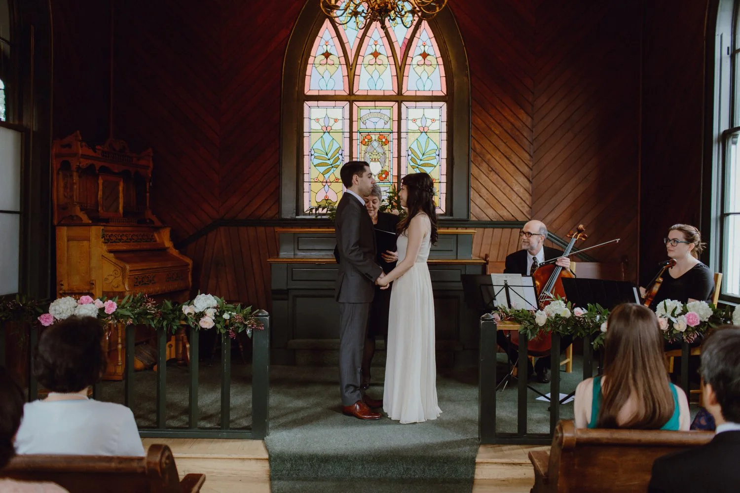A couple at the alter during their Portland wedding at Oaks Pioneer Church