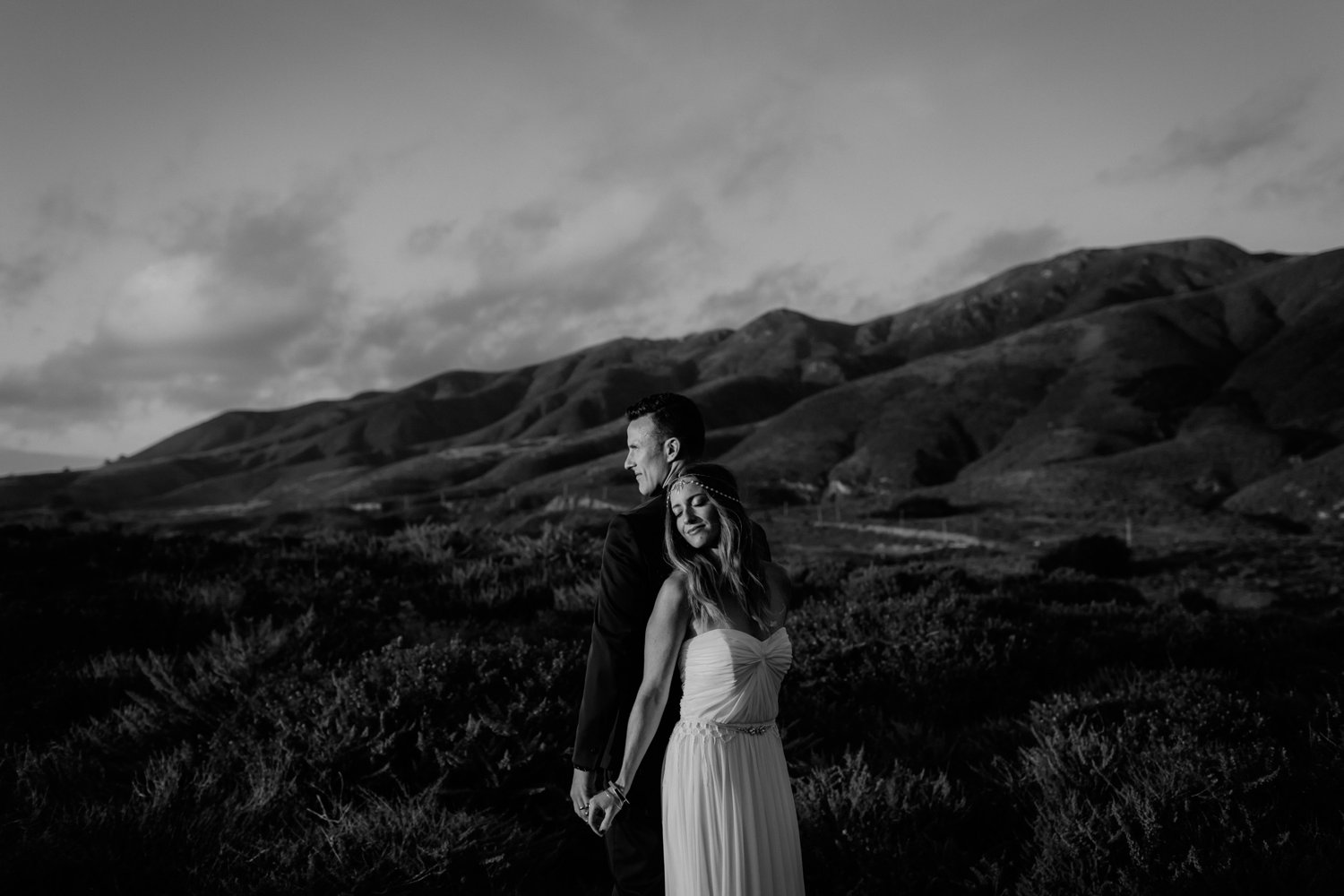 Black and white candid romantic portrait of a bride and groom