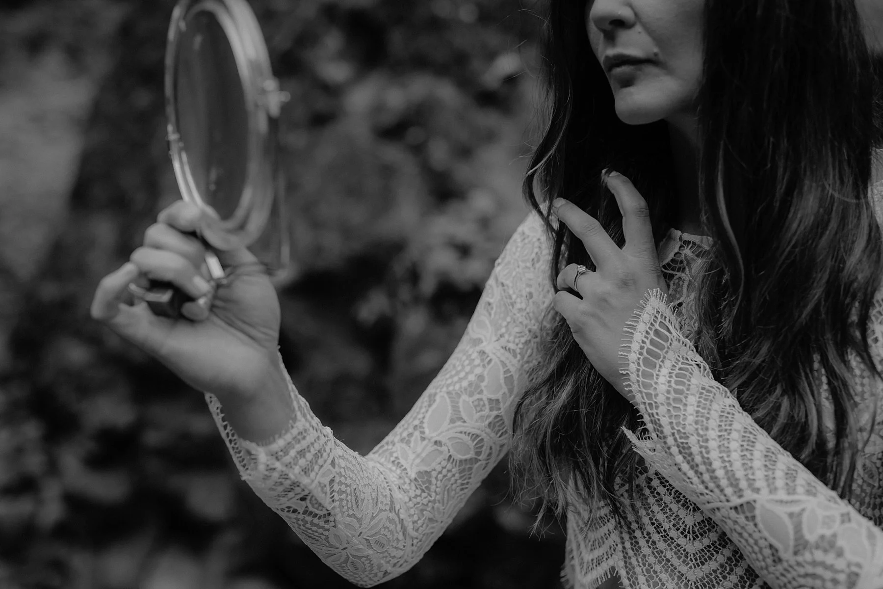 A bride puts on make up at her Wahclella Falls Elopement