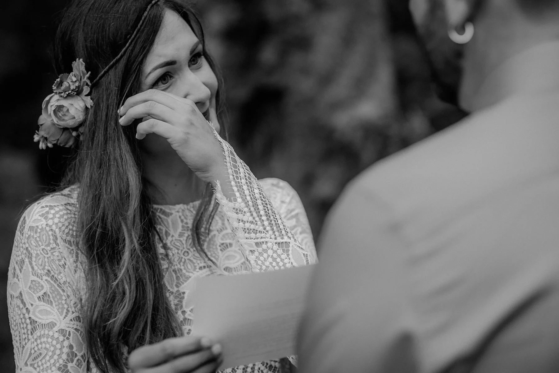 A bride cries at her elopement wedding.