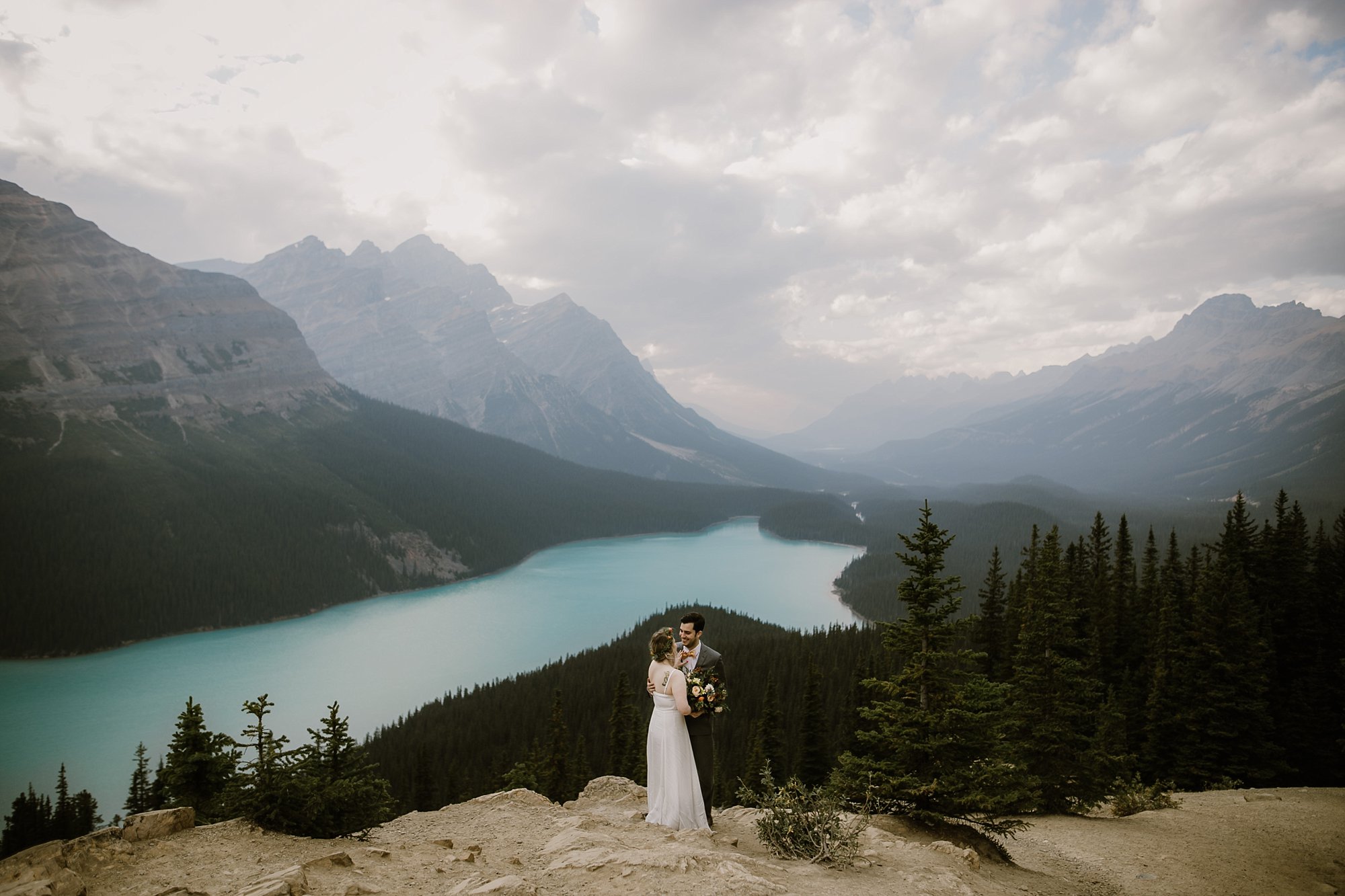 Bride and groom at Peyto Lake in Alberta Canada