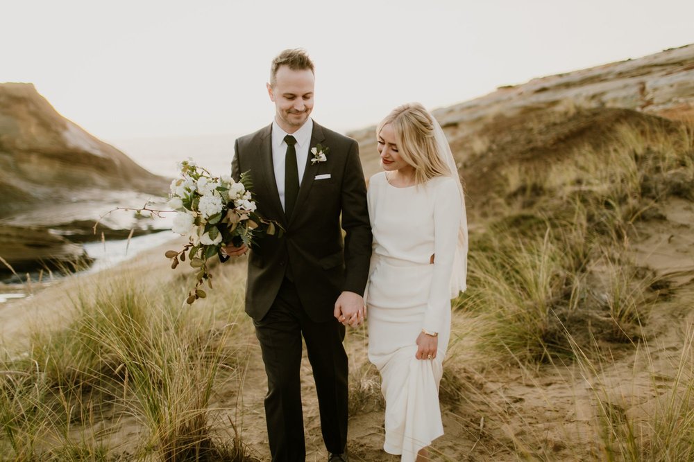 A bride and groom walk together at their Oregon elopement