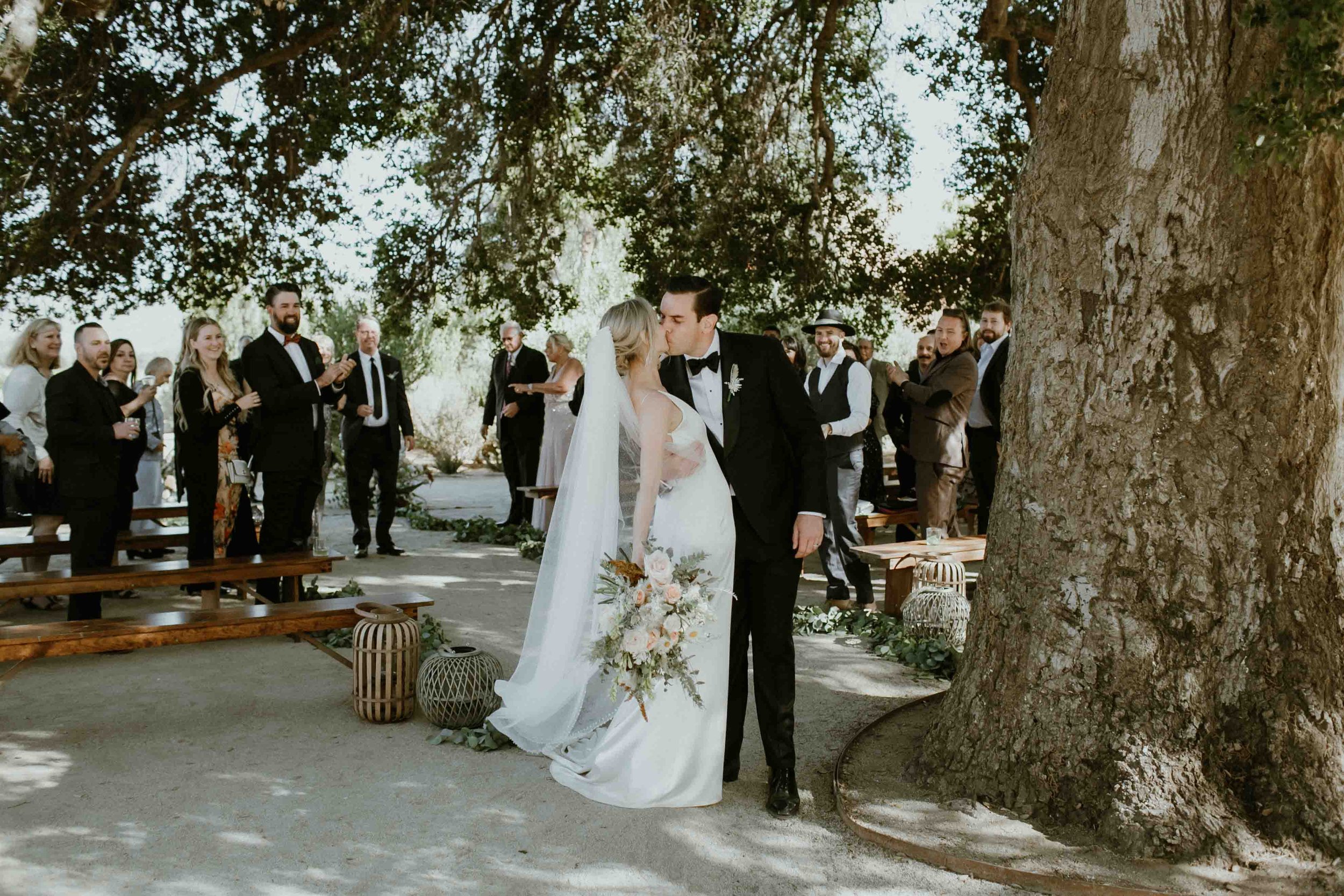 Wedding ceremony at Bruma Casa 9 in Valle De Guadalupe under a giant oak tree