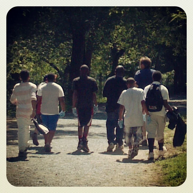 Fearless leader Bob Langston guides a group of youth off on a litter clean-up on the nature trails in the park.