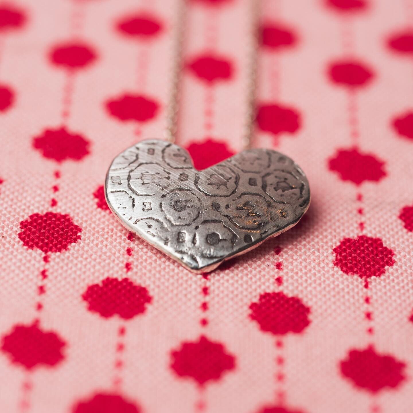 Tomorrow: A Valentine&rsquo;s Event to get your lovelight shining from 1-7PM. View limited editions and permanent jewelry specials in the shop. Fine and Sterling Silver Heart Necklace by Mary @buchanjewelry displayed on a Tea Towel by Marjie @createp
