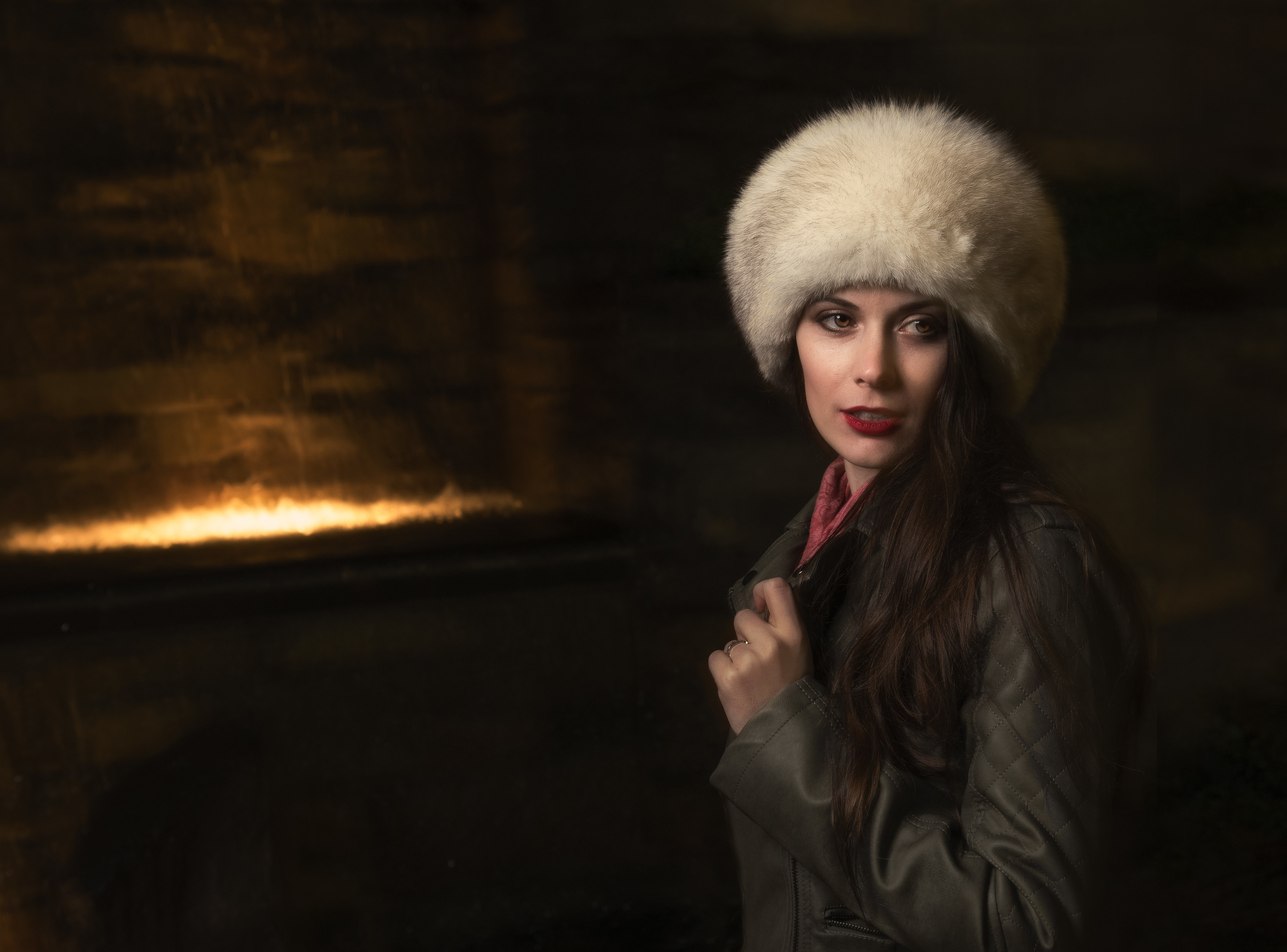 Portrait Photo of female wearing fur hat next to water feature, Cowichan Valley to Nanaimo