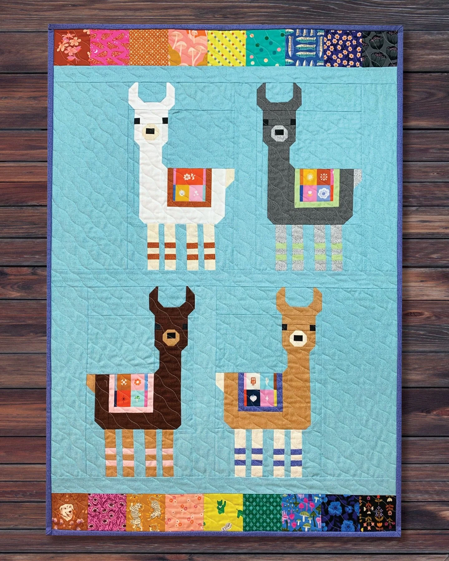 We love our latest Sew + Tell featuring Little Llamas, an adorable pattern by Elizabeth Hartman. We used some of our favorite and brightest prints from Ruby Star Society to frame the cute llamas. We have everything you need to make this or your very