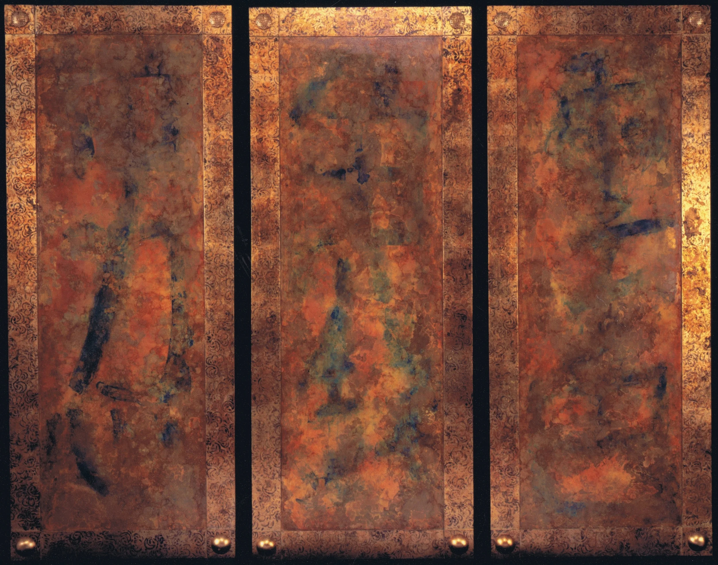 Very large screen wall panels. The border features a hand printed pattern over aged leaf and abstract Chinese calligraphy characters are seen under the chemically treated metal leaf on the center fields. Custom made gilded resin bosses at corners.