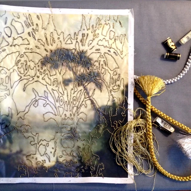 Gold thread embroidery on canvas