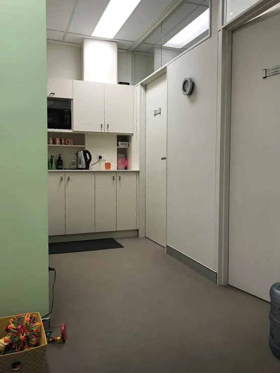 Utilitarian waiting room. Something friendy about the kettle.