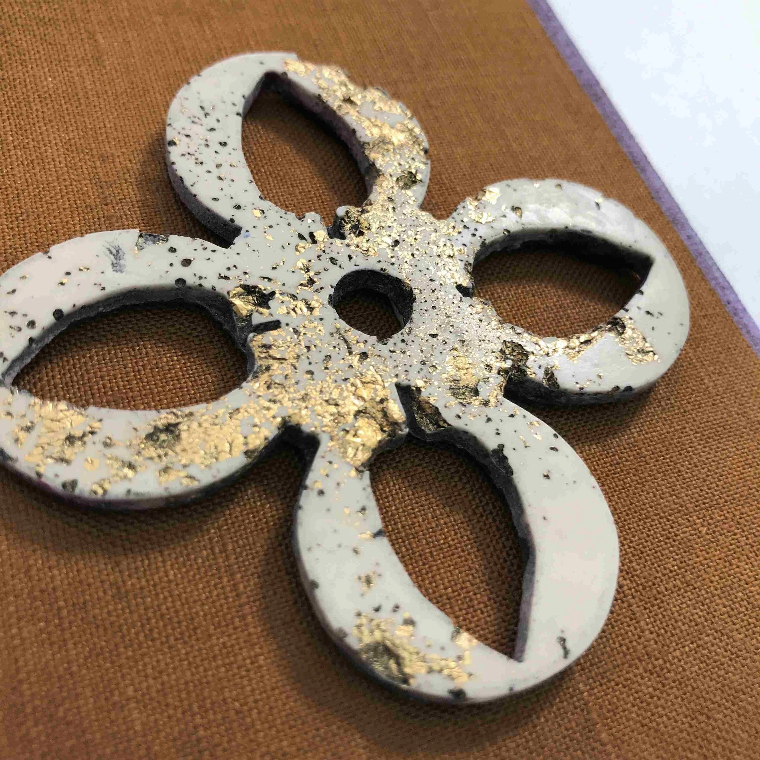 Stone plaster ornament, gold leaf inclusions