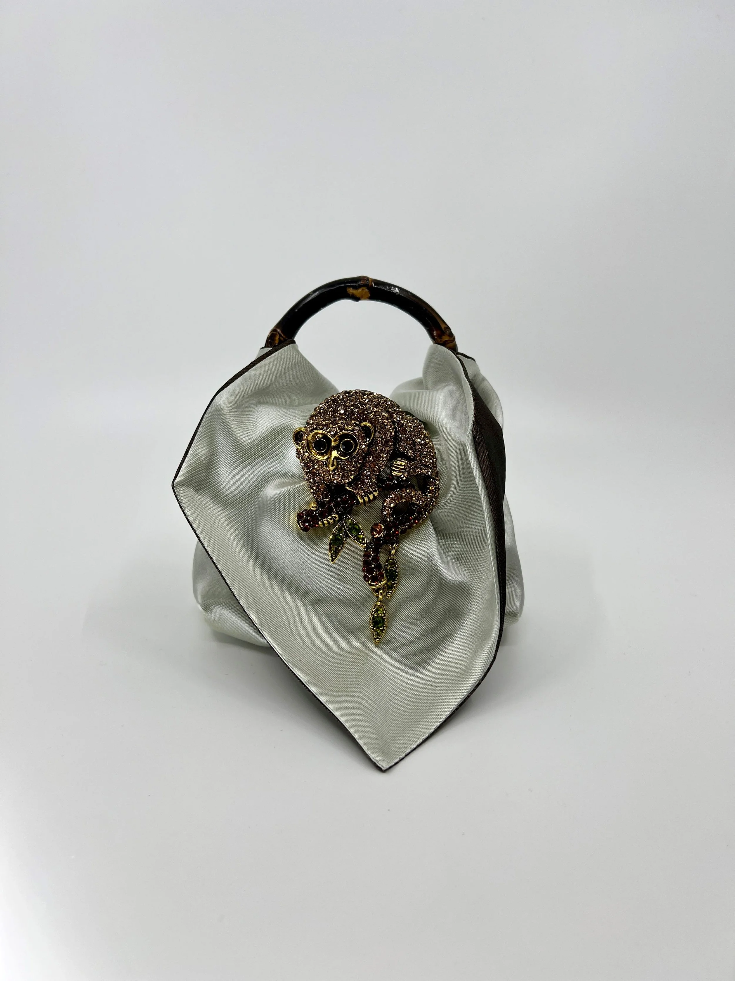 Mini bag and Possum brooch