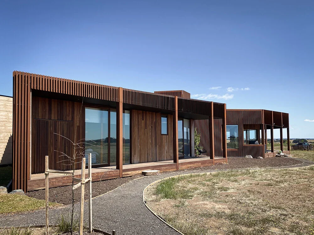 freshwater-rammed-earth-house-timber.webp