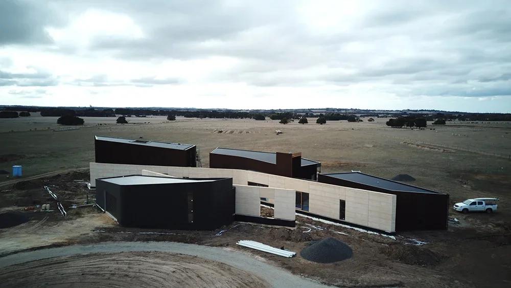 freshwater-rammed-earth-house-aerial-2.webp