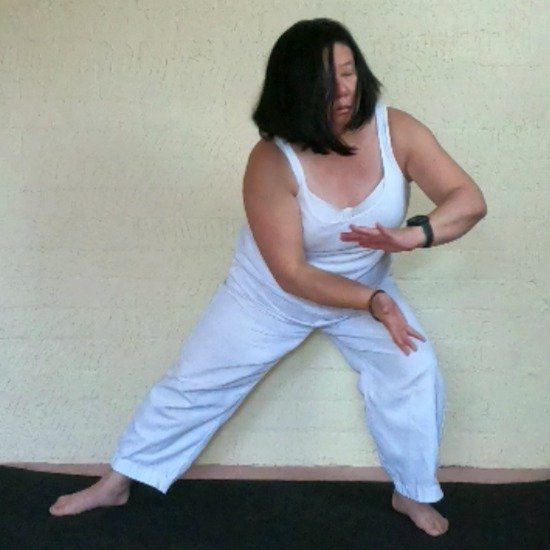 Debbie performing a side lunging movement