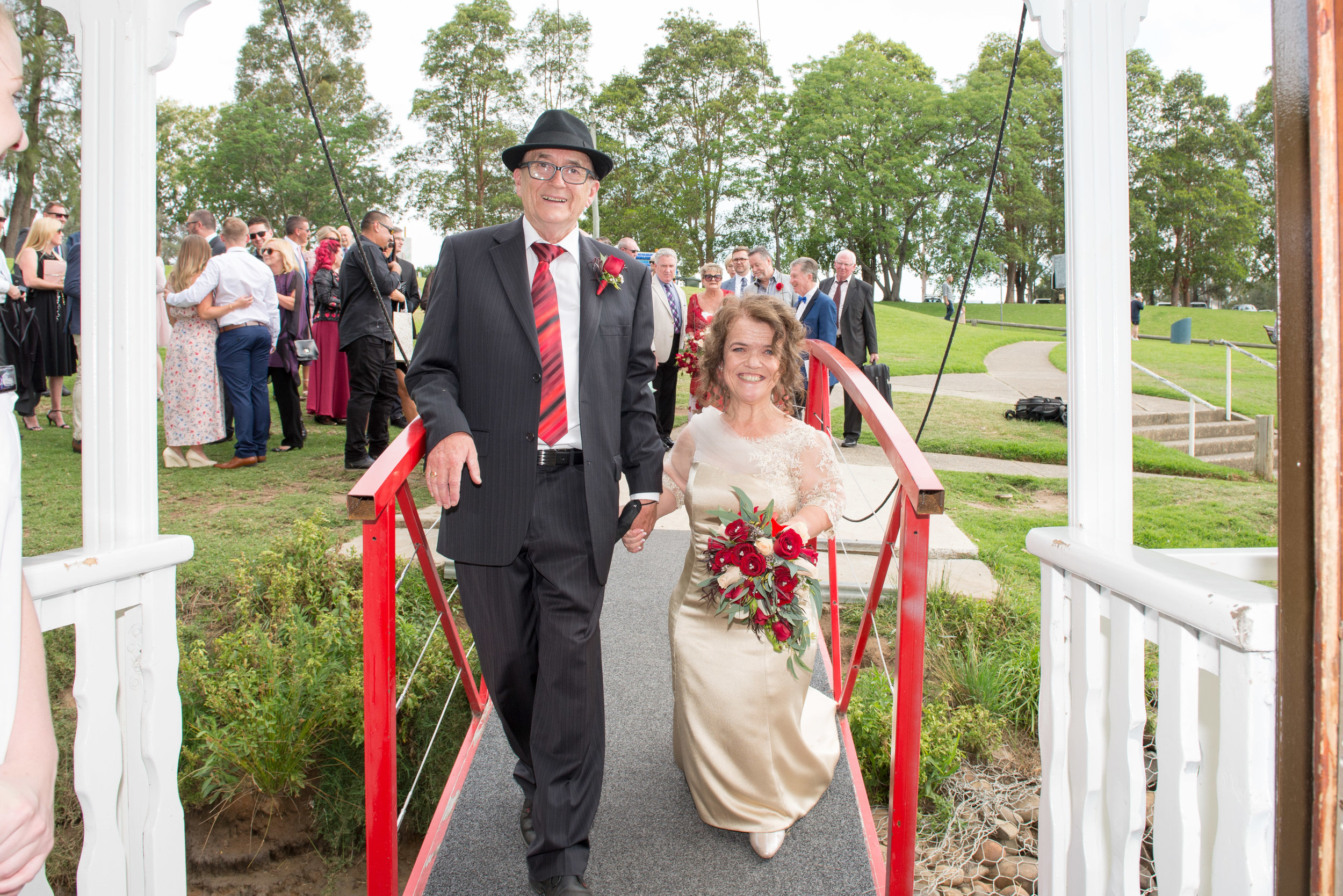 Belle wedding gangway board enter bride groom red jetty guests.jpg