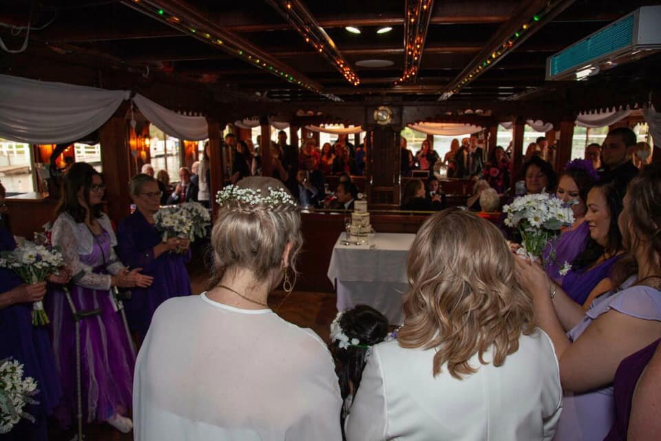 Belle wedding brides same sex interior 100 people ceremony large group.jpg