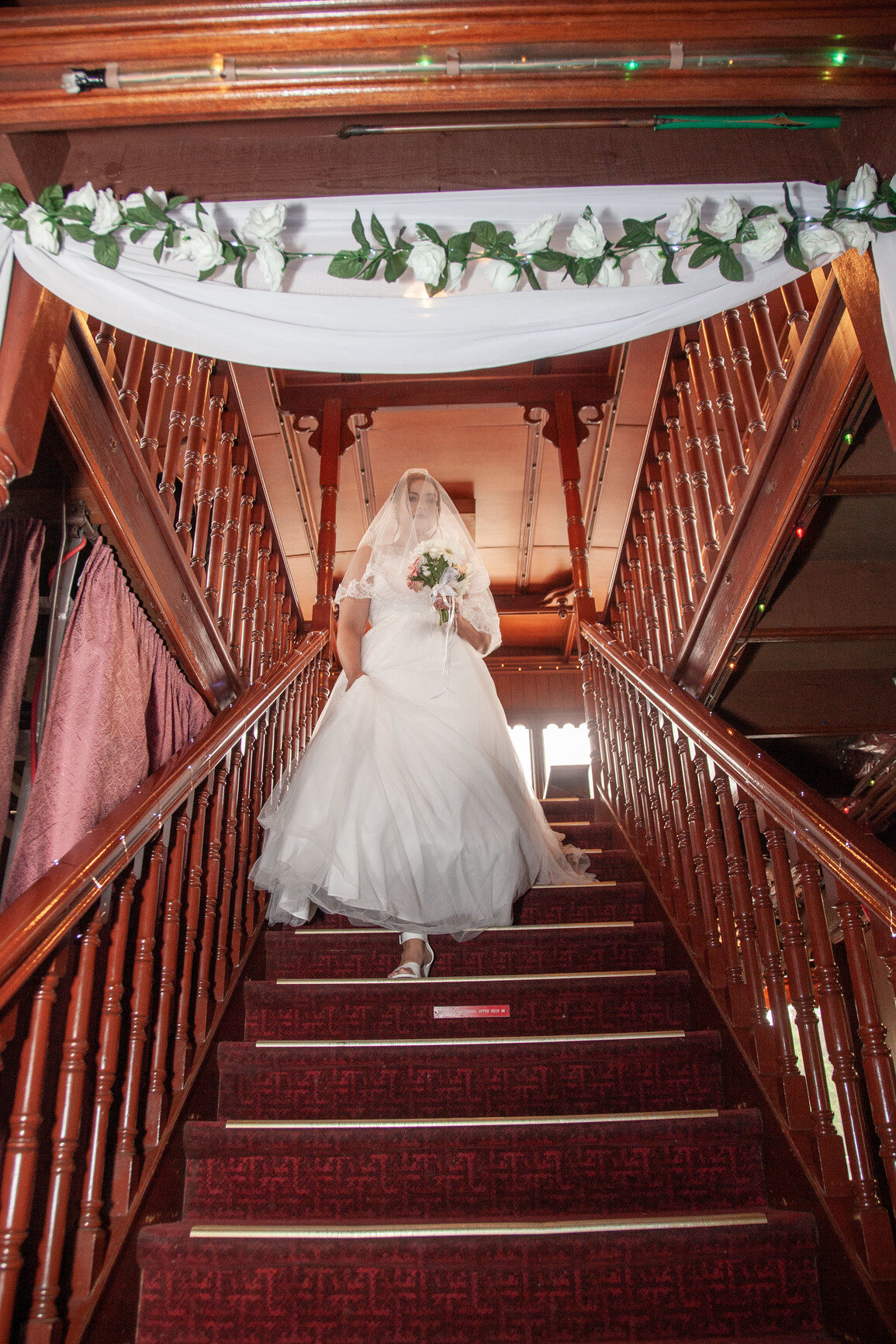 Belle wedding rhina aisle stairs drapery ceremony floers.jpg