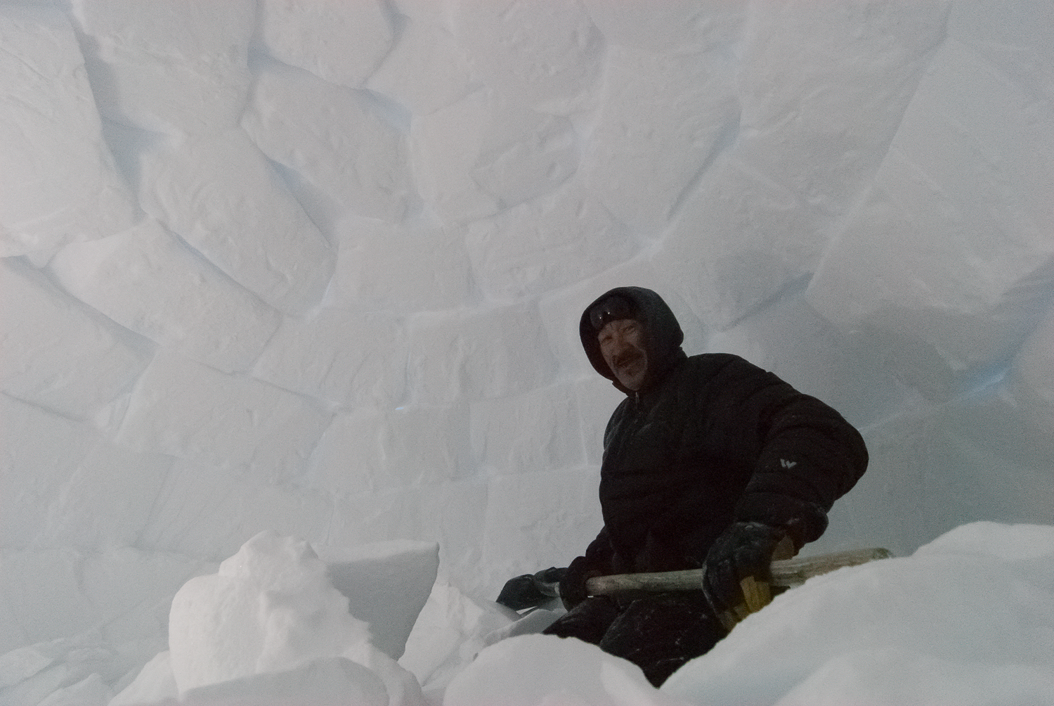 Inuit Elder Building an Igloo on the Winter Trail, Nunavik, Canadian Arctic