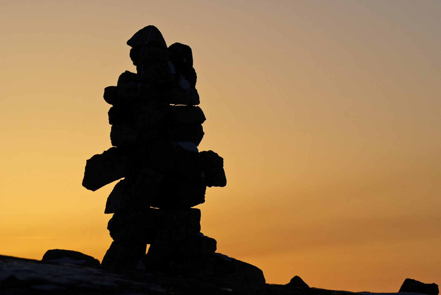 Ancient Inukshuk Guides The Way At Sunset 