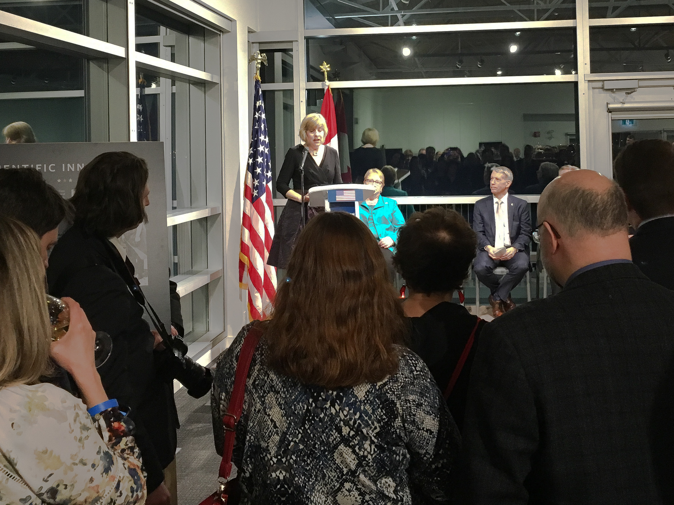 United States acting ambassador Elizabeth Moore Aubin offers remarks at the opening of the exhibition.