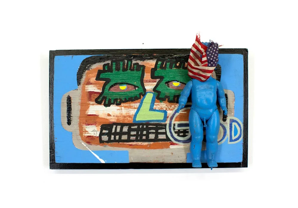 Tyree Guyton 1st Amendment - 2004 Mixed Media on Reclaimed Wood Panel, Doll, Flag, Nails 13 x 20 x 6 inches Mixed Media on Wood $5,000.00