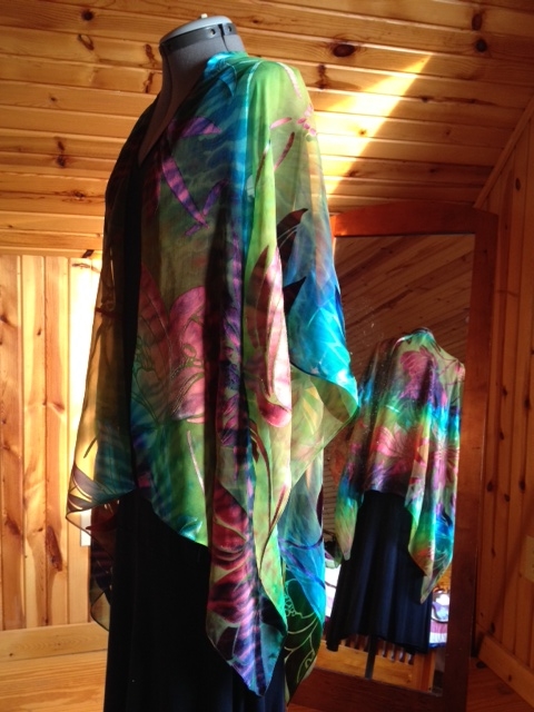 I love making these capes instead of buying blanks. They start out as 44 x 60" or 55 x 60". Serge the edges, or use the rolled hem on my Bernina. Then cut out about a 2" opening in the center and use the rolled hem attachment to finish it off. That has been a little tricky to learn, however. It makes the theory 10,000 hours of practice so true.