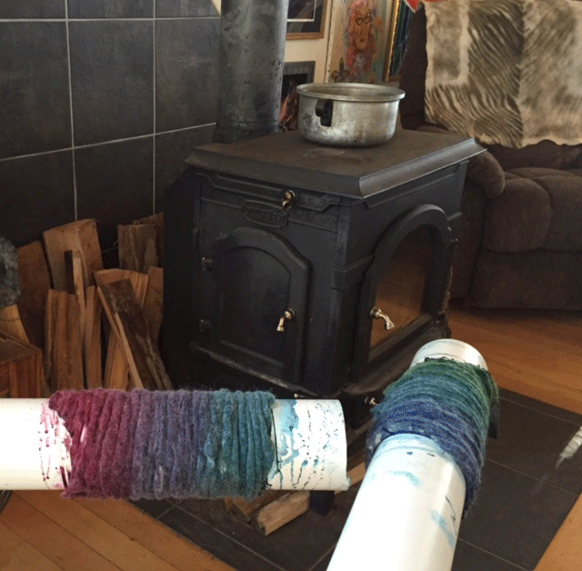 shibori felt dries by the wood stove.