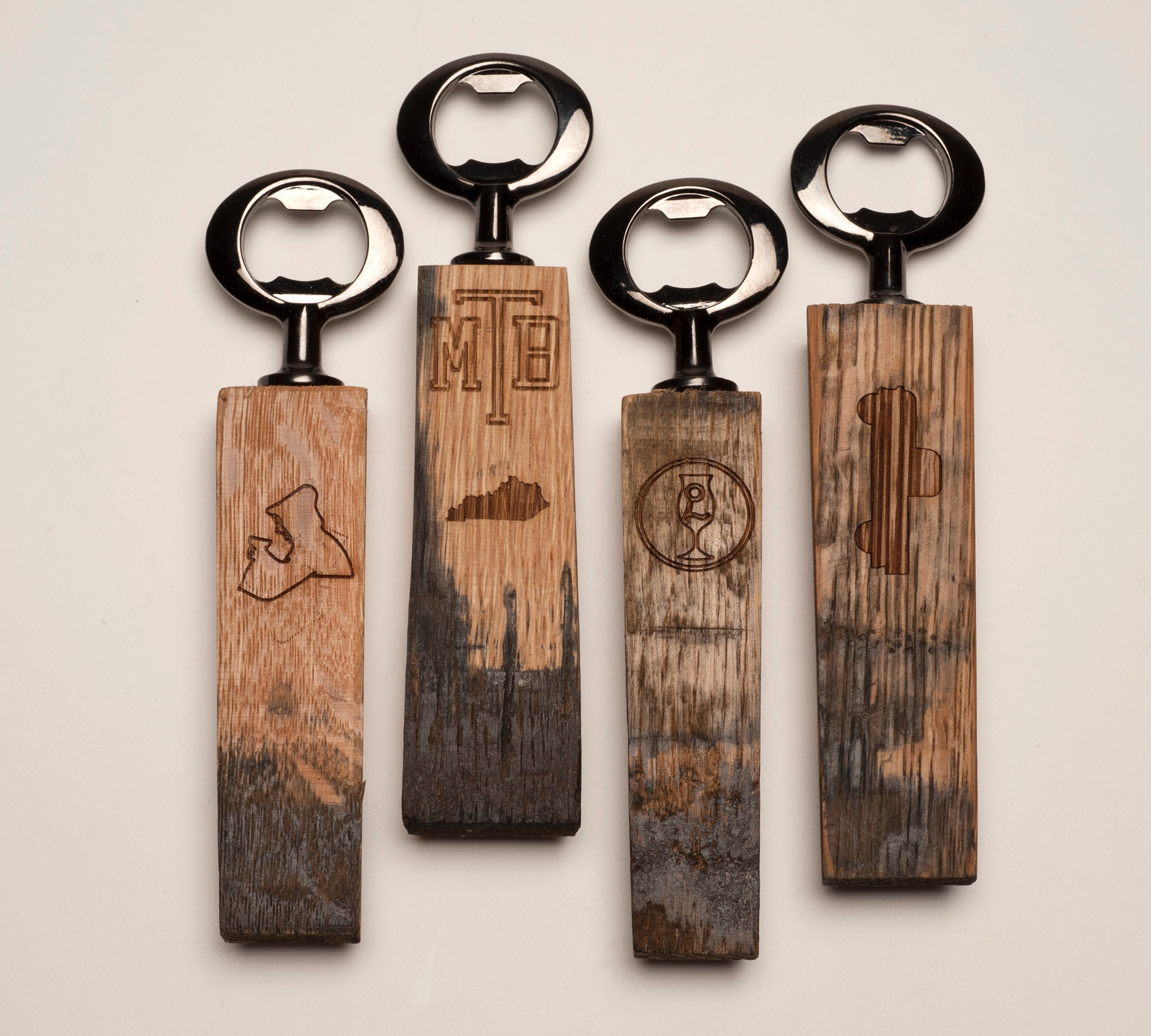 Bottle openers from recycled bourbon barrels