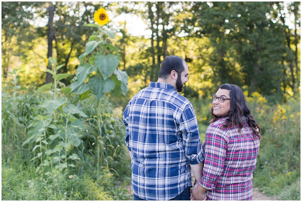 engagement photo of couple at sussex county sunflower maze