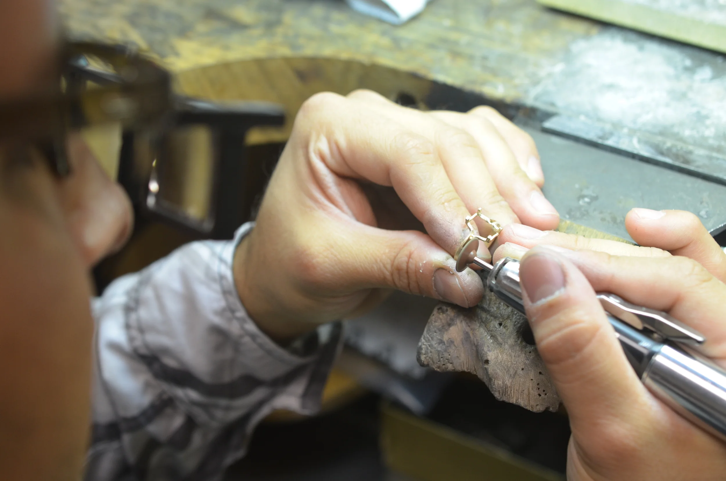 Pre-polishing of the gold setting and removal of tool marks.
